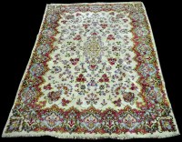 Lot 1009 - A Kerman carpet, with floral design to...