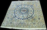 Lot 1013 - A Nain carpet, with large central rosette, 204...