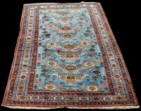 Lot 1015 - A Caucasian carpet, with medallions on light...