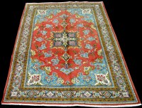 Lot 1020 - A Surok carpet, the floral sprays on red...