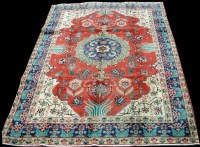 Lot 1022 - A Tabriz rug, the central foliate medallion...