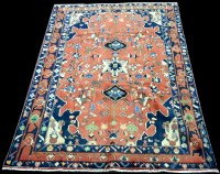 Lot 1024 - An Iranian carpet, the red ground decorated...