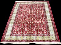 Lot 1028 - A Kashmir rug, the scrolling design on red...