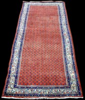 Lot 1029 - A Surok Maher runner, with boteh motifs on red...