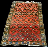 Lot 1034 - A Quashqai rug decorated with diamond-shaped...