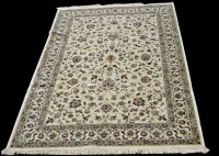 Lot 1035 - A Kashmir carpet, the scrolling floral design...