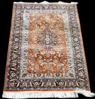 Lot 1036 - A Persian silk rug, with floral decoration and...