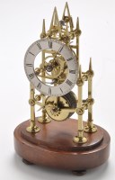 Lot 1048 - A small brass skeleton timepiece, with 3 1/2in....