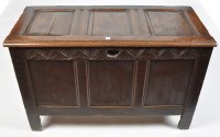 Lot 1084 - An 18th Century oak coffer, the plain panel...