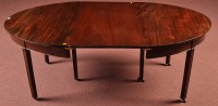 Lot 1085 - A George III mahogany dining table, the...