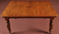 Lot 1087 - A Victorian oak extending dining table, the...