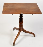 Lot 1097 - A George III oak tip-up-top table, the...