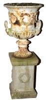 Lot 1102 - A cast iron white painted campana form urn,...