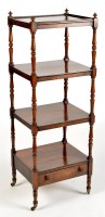 Lot 1105 - A Regency rosewood four-tier whatnot, raised...