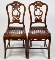 Lot 1108 - A pair of carved Chinese hardwood chairs, with...