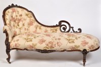 Lot 1115 - A Victorian carved mahogany chaise longue, the...