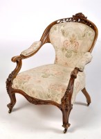 Lot 1117 - A Victorian carved walnut nursing chair, with...