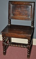 Lot 1118 - A 17th/18th Century oak hall chair, with panel...