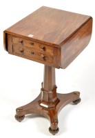 Lot 1119 - A Regency mahogany work table, with fall-flaps...
