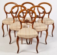 Lot 1135 - A set of six Victorian walnut balloon back...