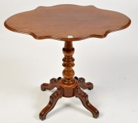 Lot 1136 - A Victorian mahogany table, the shaped...