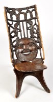 Lot 1148 - A 20th Century African carved hardwood...