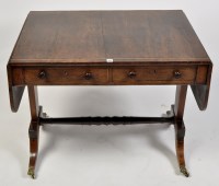 Lot 1151 - A Regency mahogany sofa table, the top and...