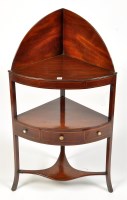 Lot 1154 - A George III mahogany bowfront washstand,...