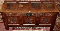 Lot 1163 - An 18th Century oak coffer, the plain panel...