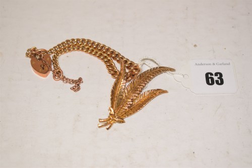 Lot 63 - A 9ct. gold fern pattern brooch; together with...