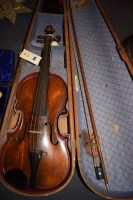 Lot 404 - A violin with single piece back and paper...