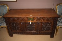 Lot 778 - An 18th Century oak coffer, with carved leaf...