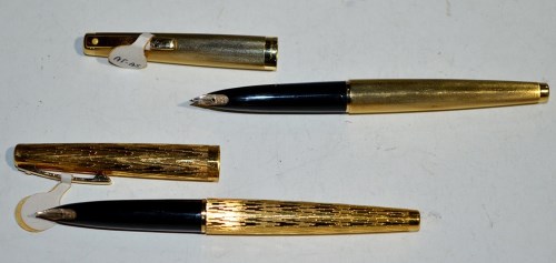 Lot 25 - Two Sheaffer fountain pens in gold plated...