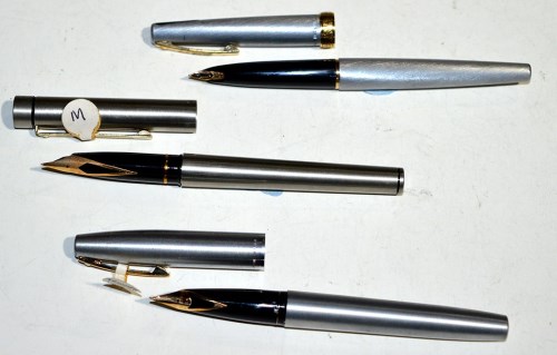 Lot 31 - Three steel cased Sheaffer fountain pens, one...