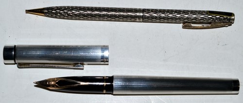 Lot 35 - A sterling silver cased Sheaffer fountain pen,...