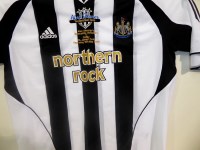 Lot 109 - A Newcastle United replica shirt commemorating...