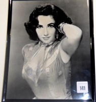 Lot 141 - A signed photograph of Elizabeth Taylor,...