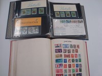Lot 183 - An album of World stamps; together with an...
