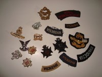 Lot 233 - A quantity of Rhodesia regiment cap and cloth...