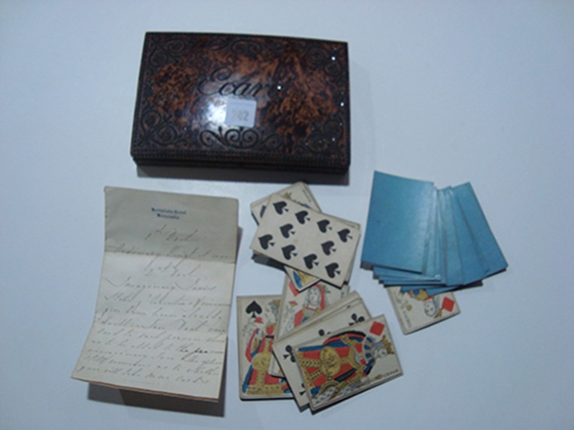 Lot 242 An Ecarte card game, the burr wood box with