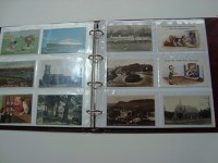 Lot 247 - An album of postcards, interests include:...