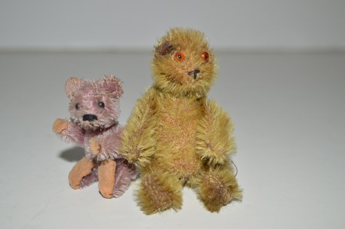 Lot 326 - A Schuco miniature pink teddy bear; together...