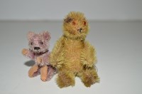 Lot 326 - A Schuco miniature pink teddy bear; together...