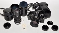Lot 355 - An Olympus OM10 SLR camera, with standard case...
