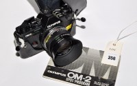 Lot 356 - An Olympus OM-2 spot/program SLR camera...