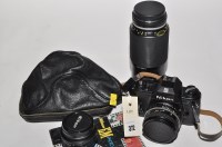 Lot 372 - A Nikon EM SLR camera with E-series 28mm, 50mm...