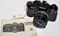 Lot 373 - A Canon EF 35mm SLR camera, fitted FD 50mm...