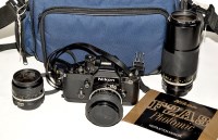Lot 393 - A Nikon F2 AS SLR camera (black); with Nikkor...