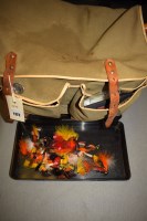 Lot 1172 - A canvas fishing bag containing large Hardy...