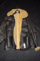Lot 1202 - A gentleman's leather motor cycle jacket with...